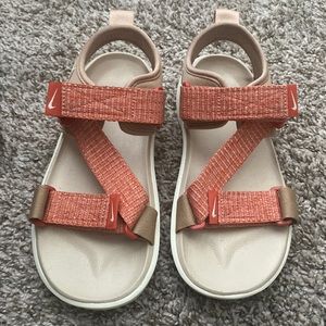 Peach colored Nike Sandals